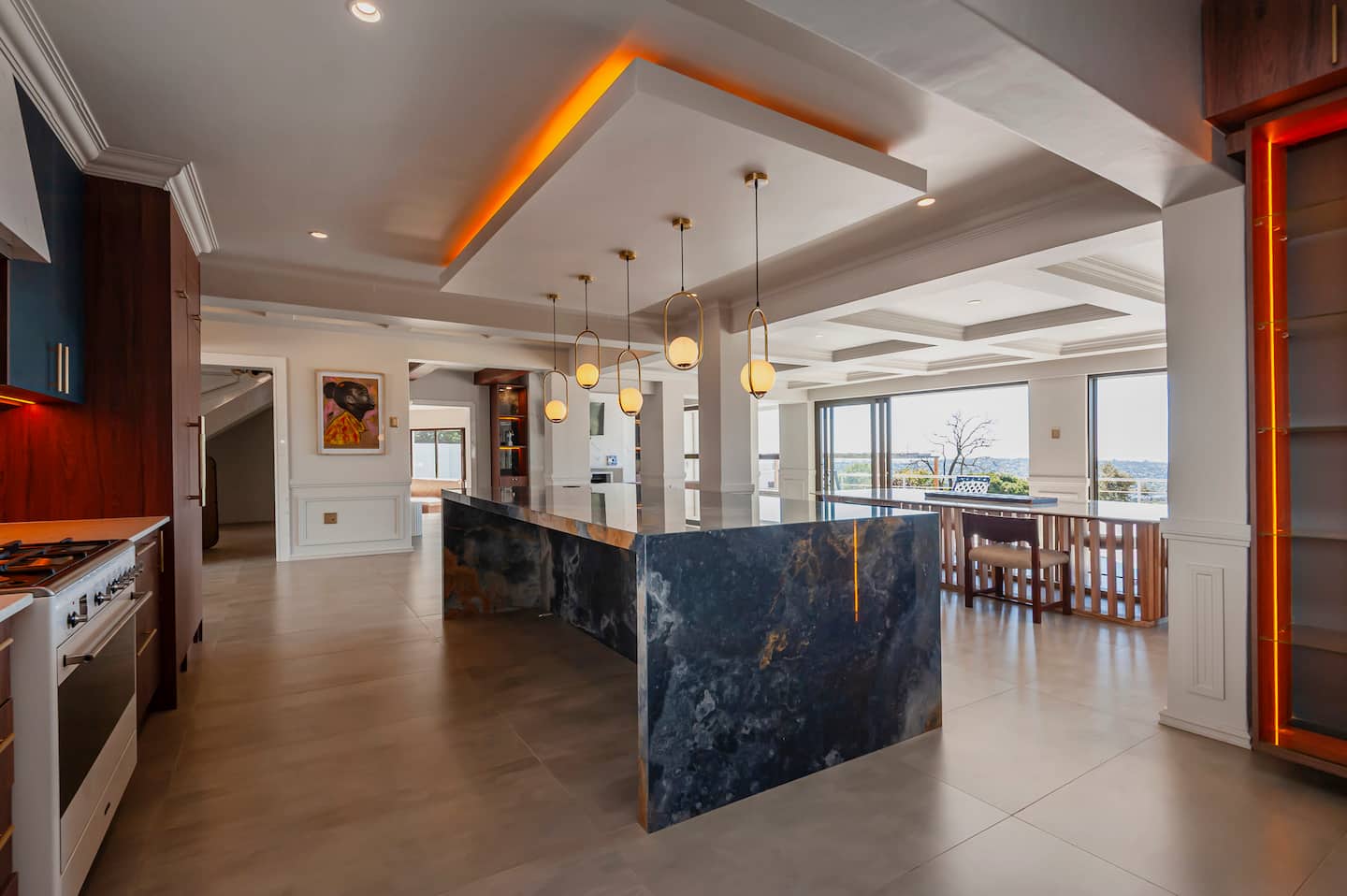 Open-plan kitchen with marble island