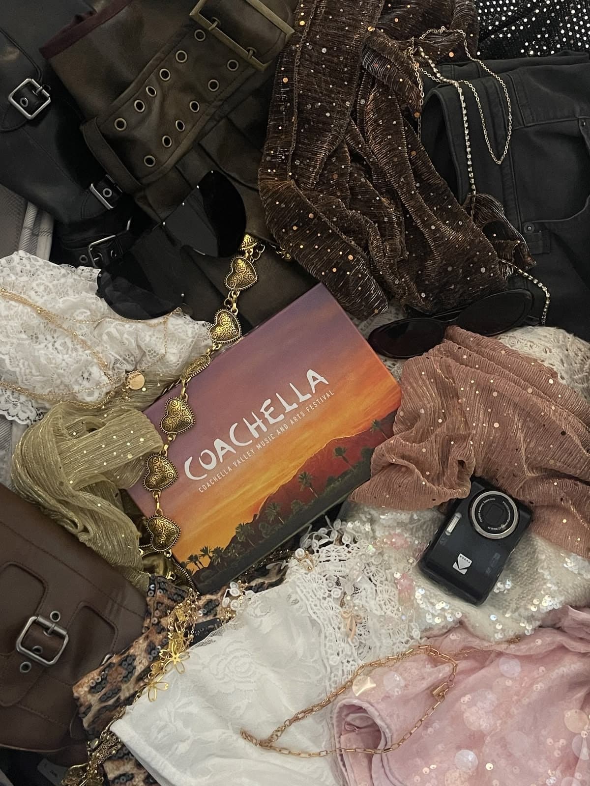 Festival outfit flat-lay with lace, sequins, boots and gold chains